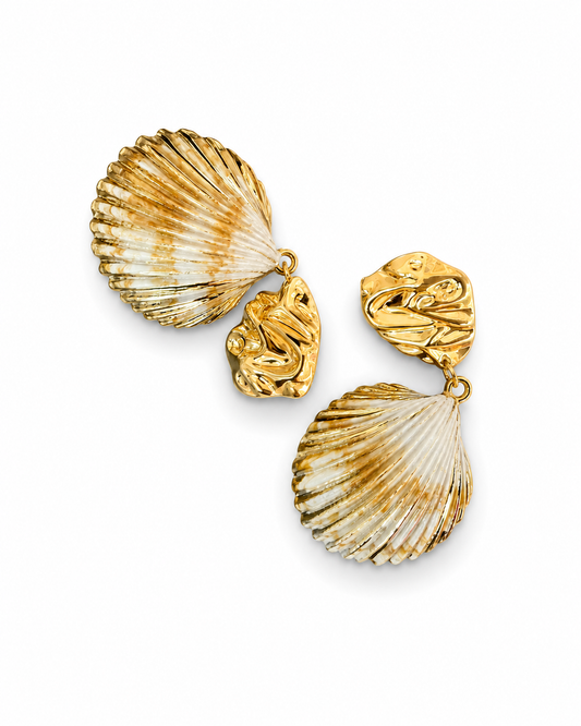 Angled view of SCALLIA earrings showing the fan ribbing and cream-to-caramel banding across the shell drops