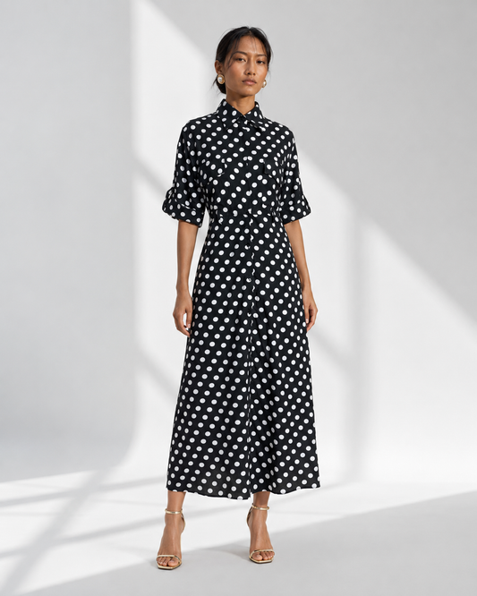 Neha Sharma Label SIMONE black polka dot crepe maxi shirt dress with collar, front view on model.