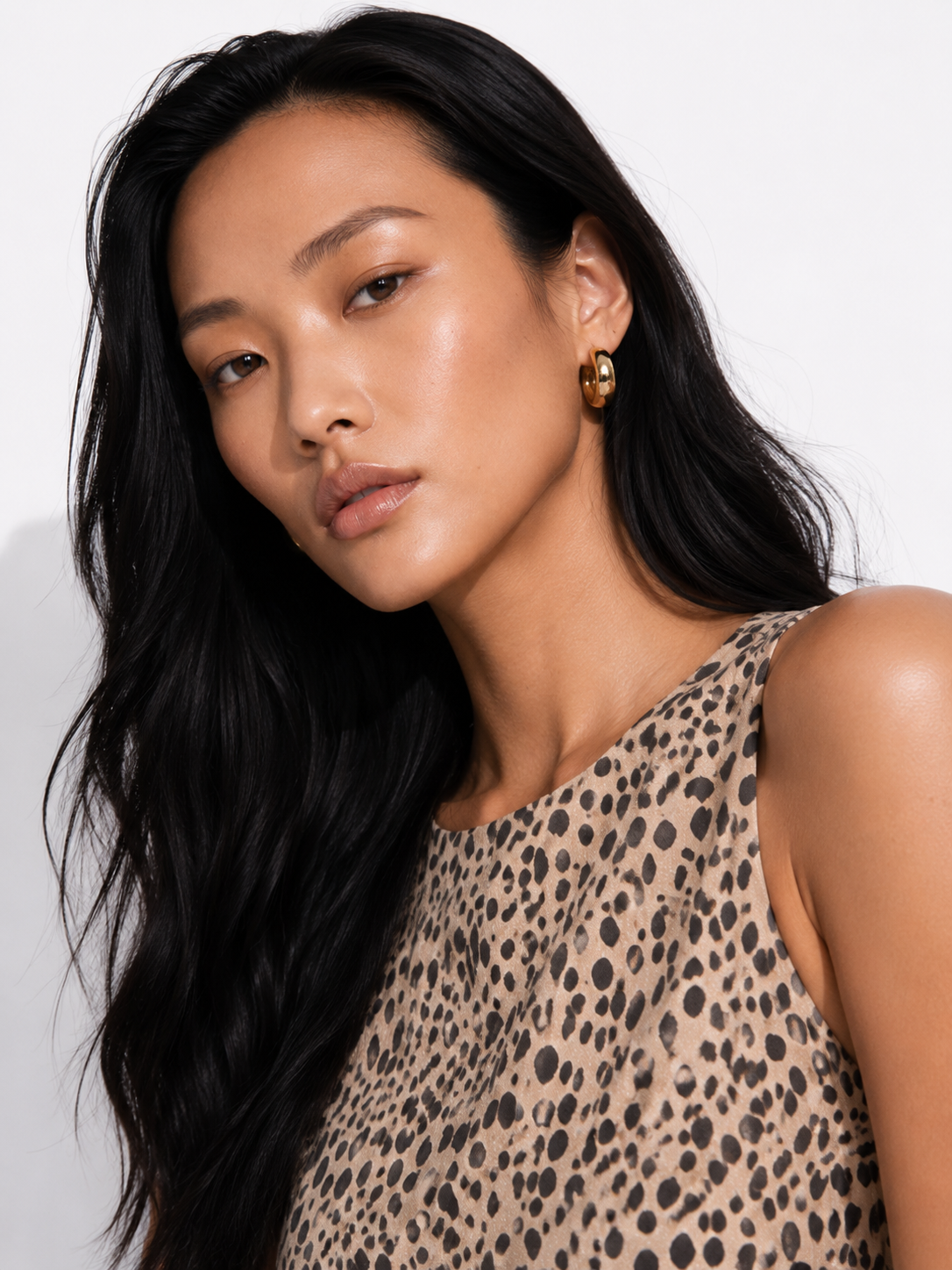 HAZEL tan cheetah print jumpsuit with boat neckline and self-tie waist.