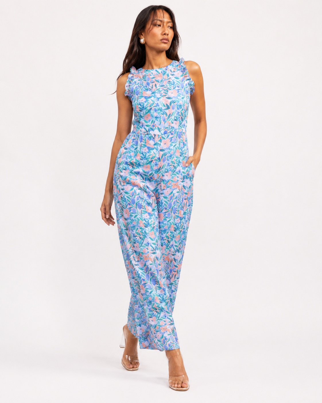 Model wearing FLEUR pastel floral print wide-leg jumpsuit by Neha Sharma Label.