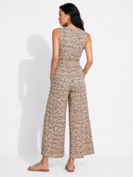 Back view of the HAZEL cheetah print jumpsuit showing the wide legs.