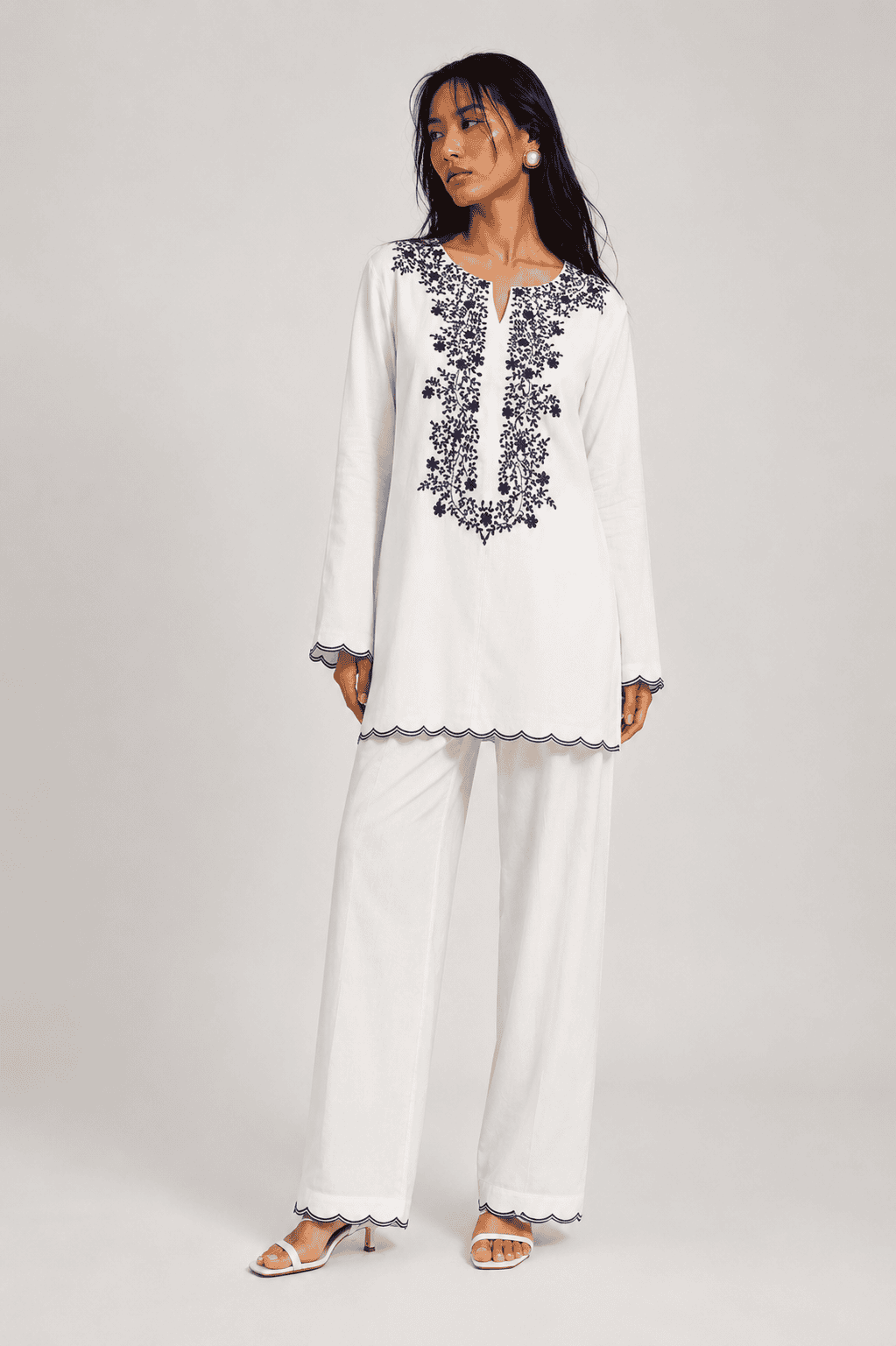 Neha Sharma Label SUNSPELL white pure cotton kurta set with navy floral embroidery.