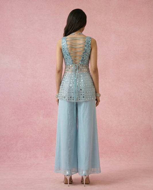 Criss-cross dori tie-up back with hanging tie tails on the MAHTAB powder blue mirror work kurta.
