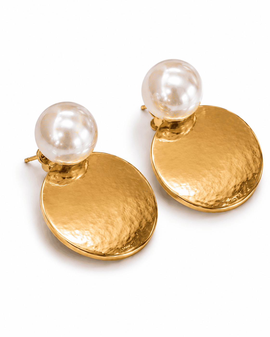 Angled view of CONCA earrings showing the dished hammered disc and the push-back post