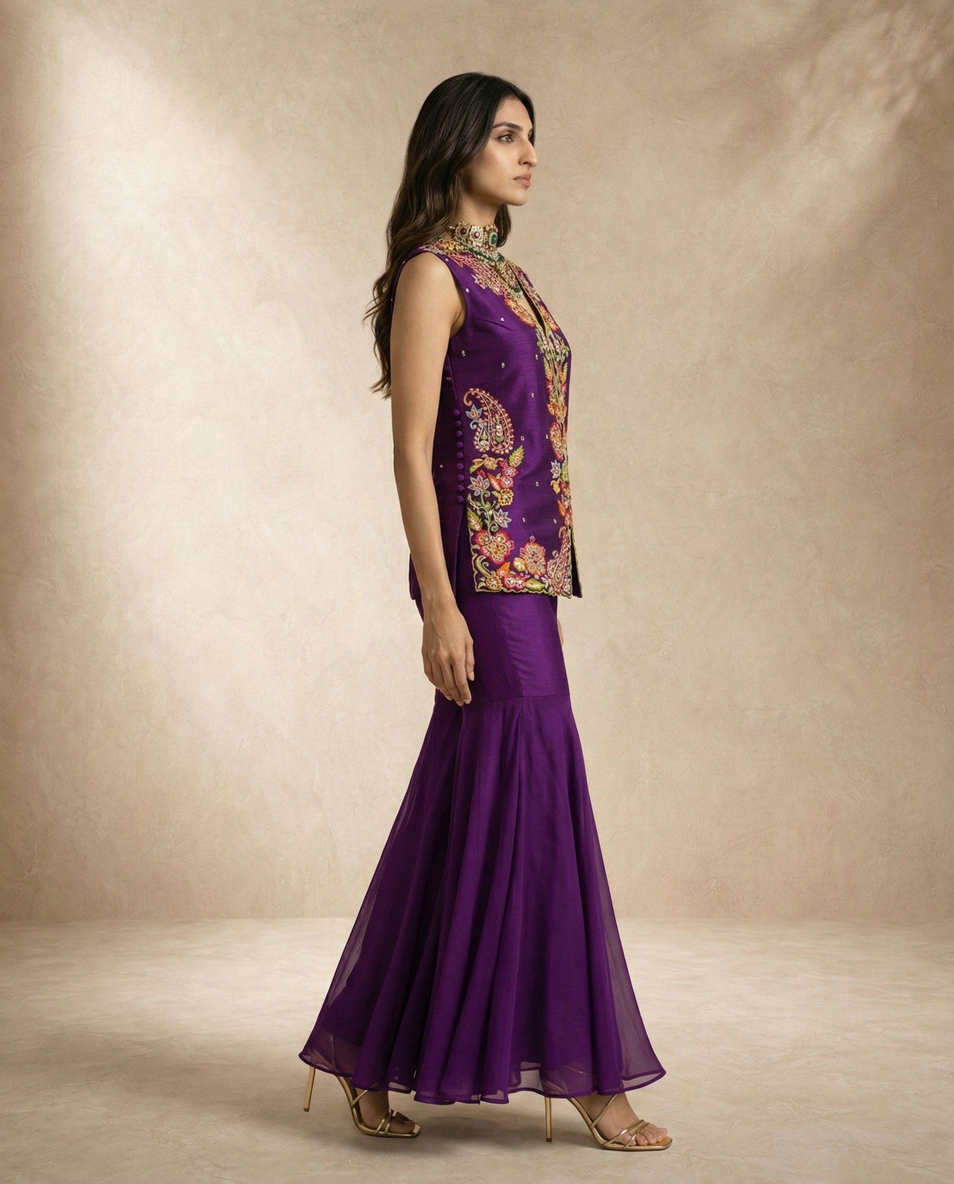 HIYA purple embroidered top and gharara set by Neha Sharma Label, styled with gold jewellery.