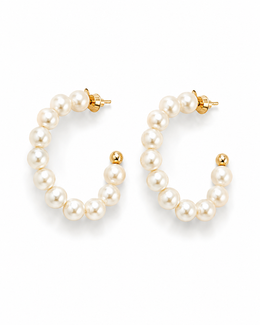 LORELEI pearl beaded hoops shown at an angle with the gold bead terminal and push back visible
