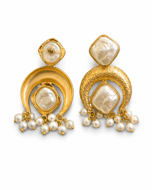 NADIYA earrings shown front and back, with the engraved coin-punch crescent and the plain reverse