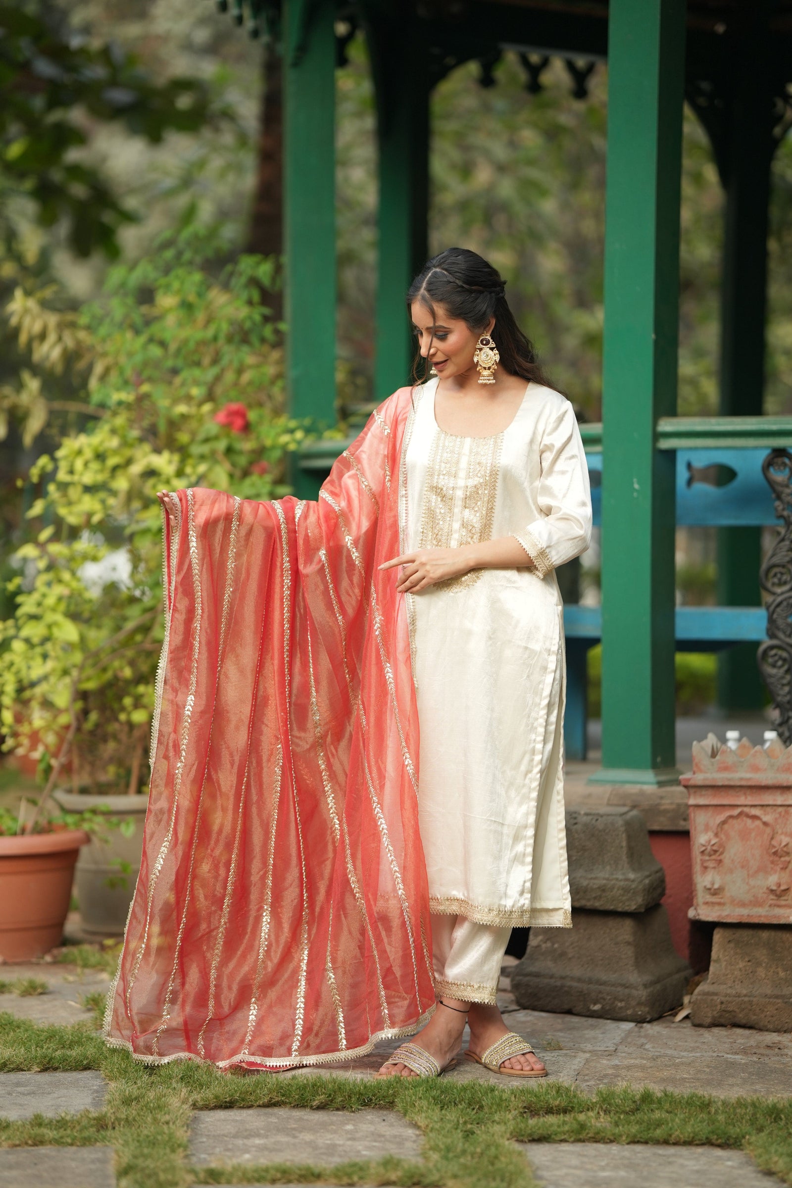 Neha Sharma Label ARTISAN'S MOTIF off white silk kurta set with a vermilion dupatta.