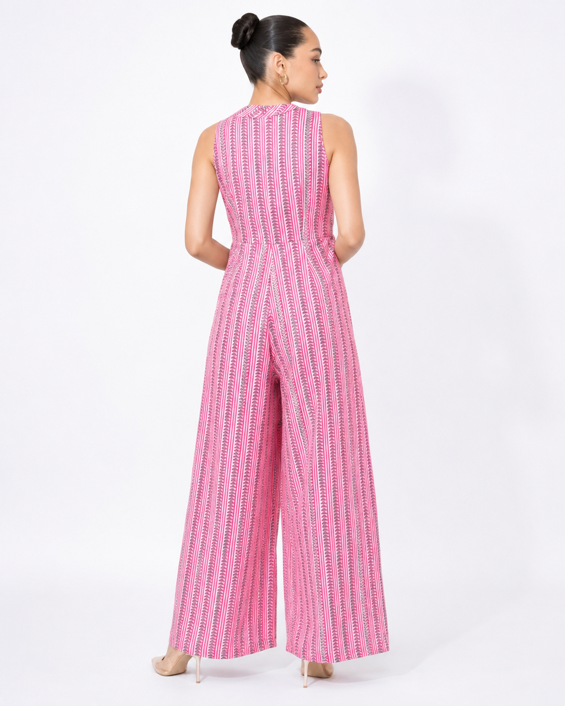 Back view of the DAHLIA pink stripe and petal print cotton jumpsuit.
