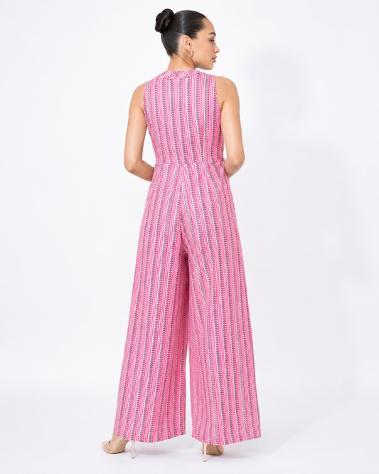 Back view of the DAHLIA pink stripe and petal print cotton jumpsuit.