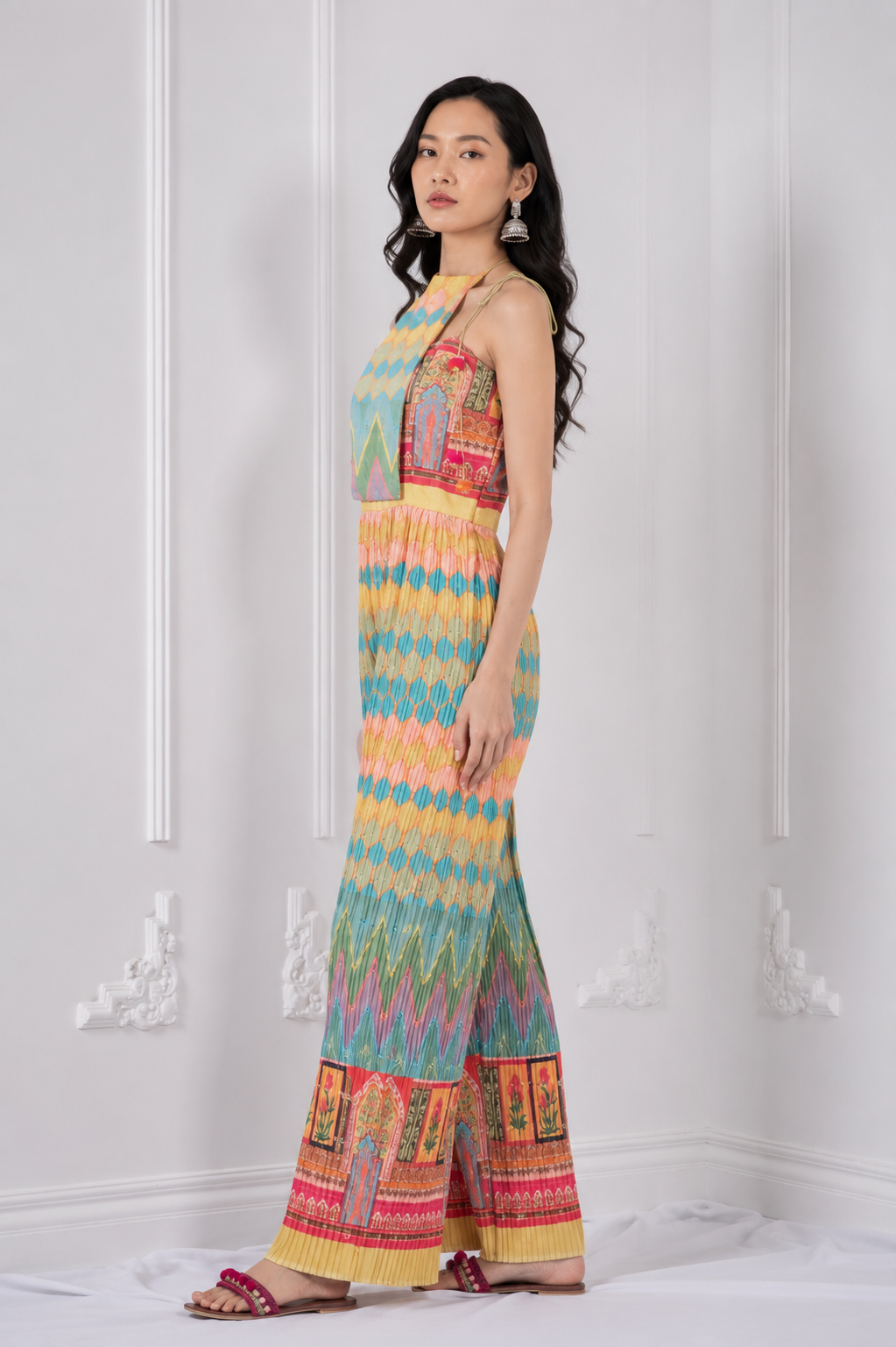 Model wearing LUCIA multicolour printed halter jumpsuit by Neha Sharma Label.