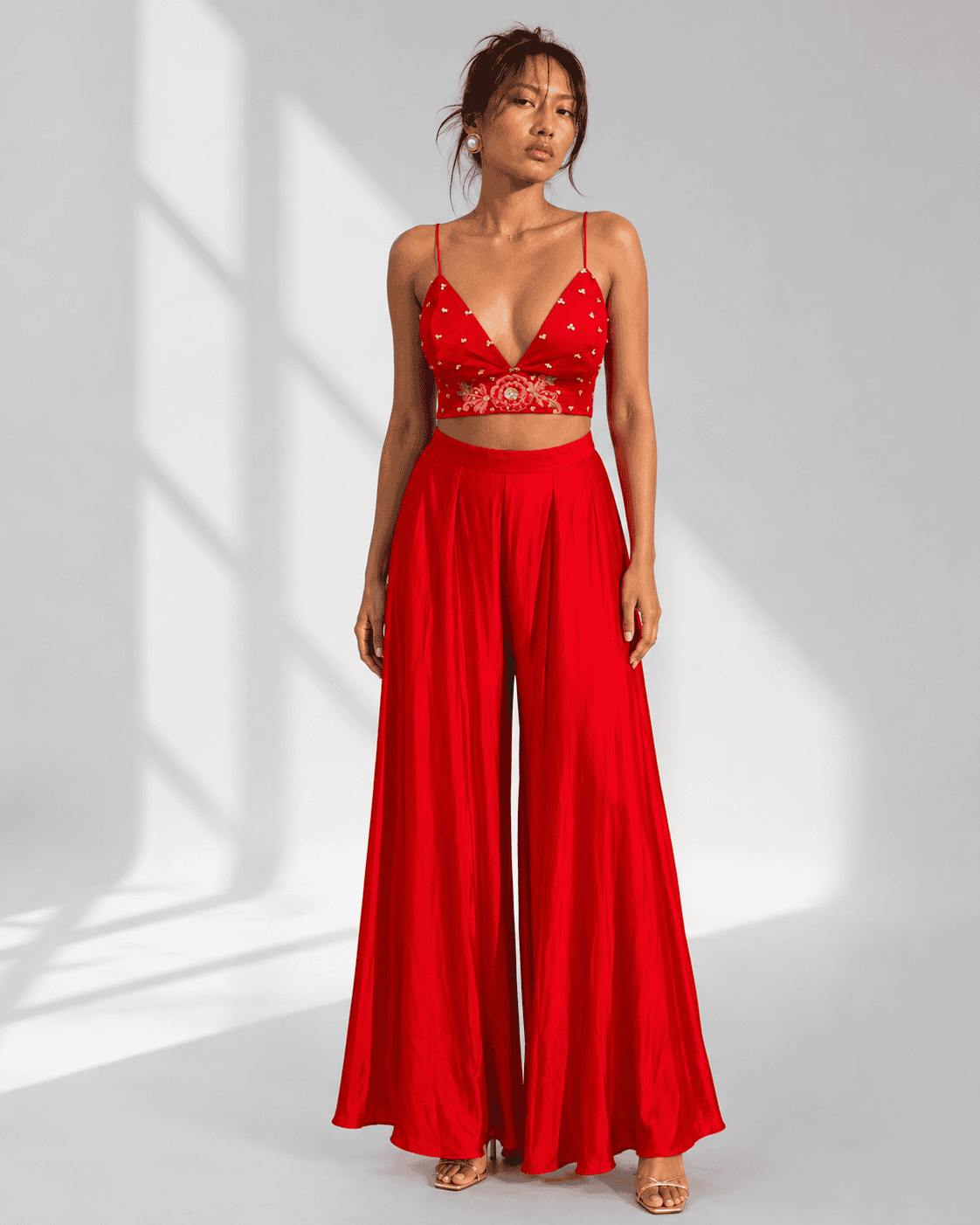 ROSELLA red embroidered bralette and pleated palazzo set by Neha Sharma Label