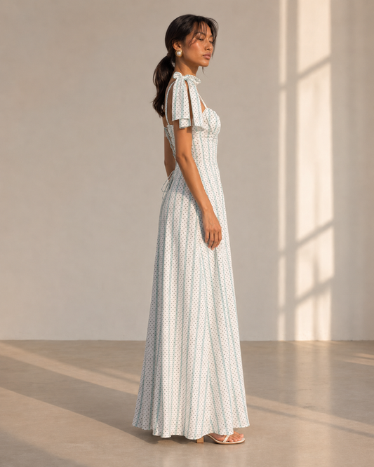 SYLVIE white dot stripe maxi dress with corset-seamed sweetheart bodice and tie-shoulder bows.