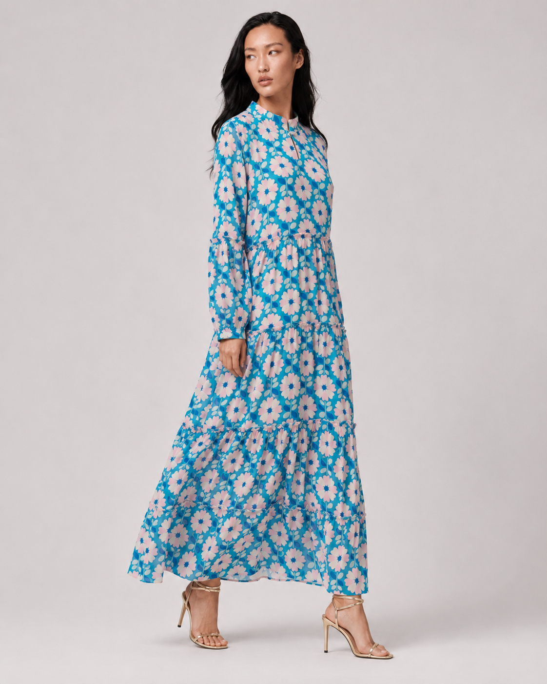 SABLE blue retro floral georgette maxi with keyhole button neck and blouson sleeves by Neha Sharma Label