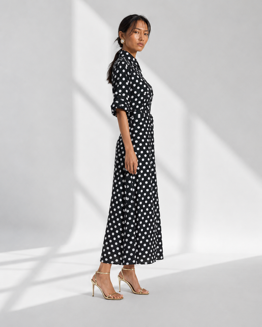 SIMONE black and white polka dot maxi shirt dress in profile with elbow roll-tab sleeves.
