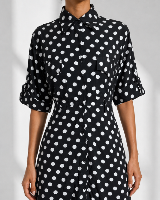 Close view of the pointed collar, flap chest pocket and button placket on the SIMONE dress.