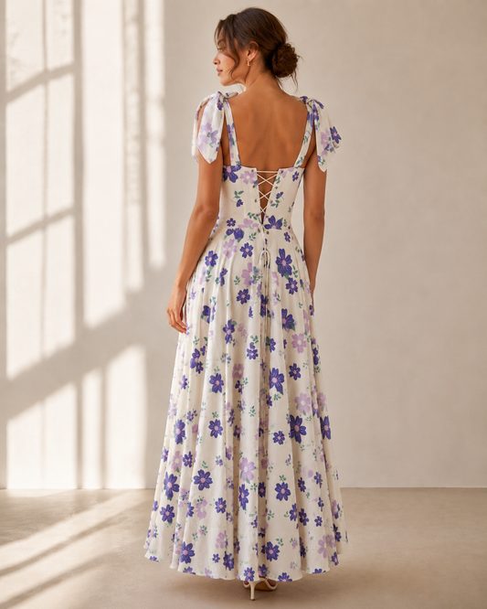 Back view of the DELPHINE purple floral maxi dress showing the grommet lace-up back.