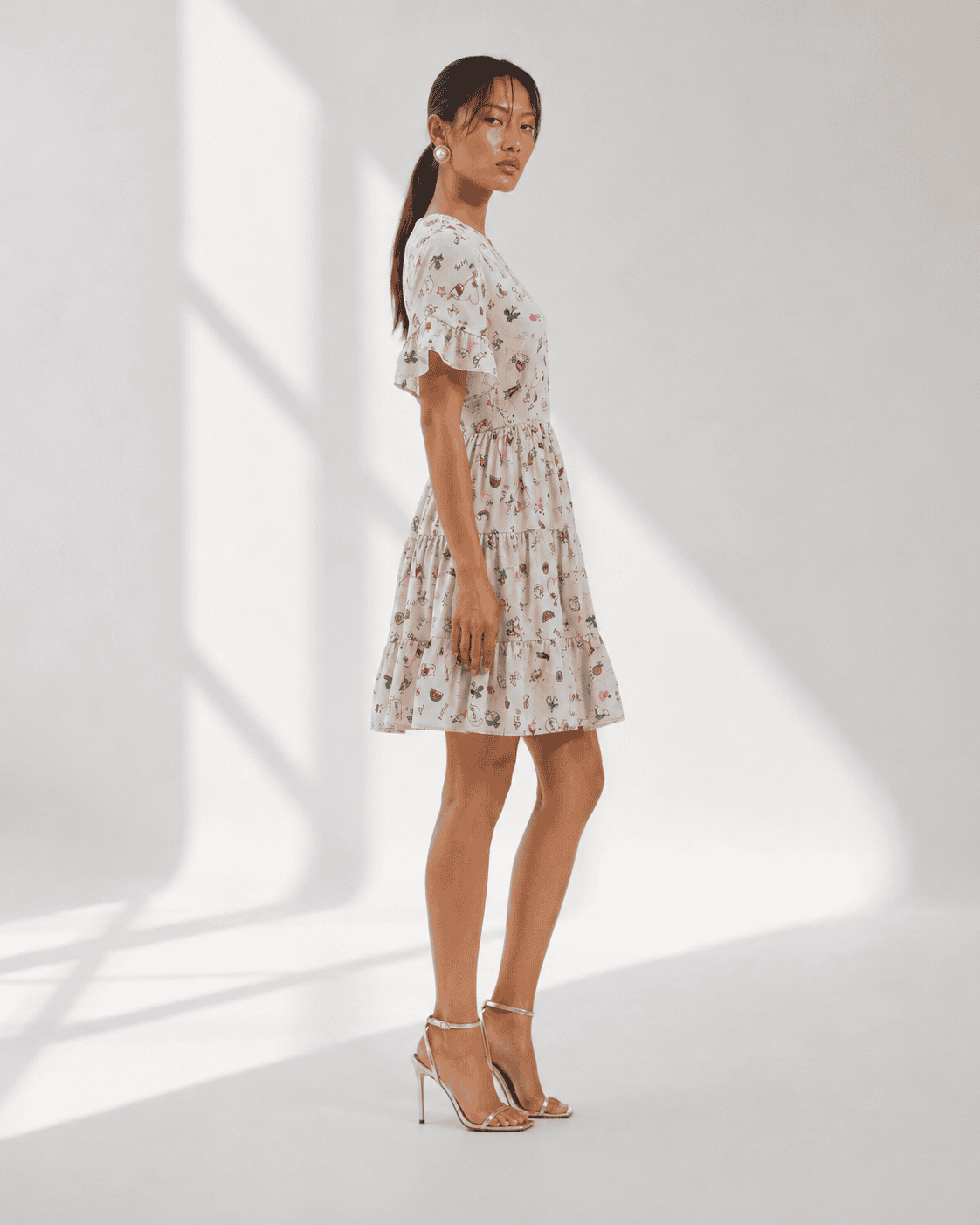 ELORA ivory crepe mini dress with playful doodle print and gathered waist by Neha Sharma Label