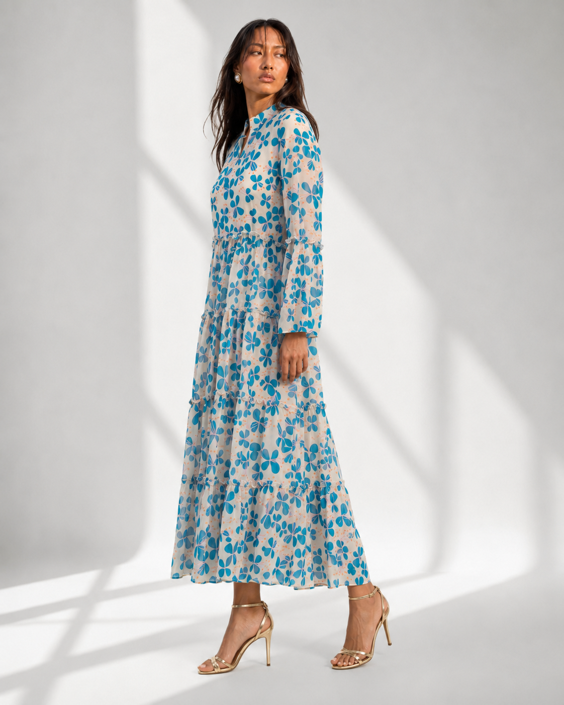 MIRELLE blue petal print georgette maxi with notched neckline and tie button by Neha Sharma Label