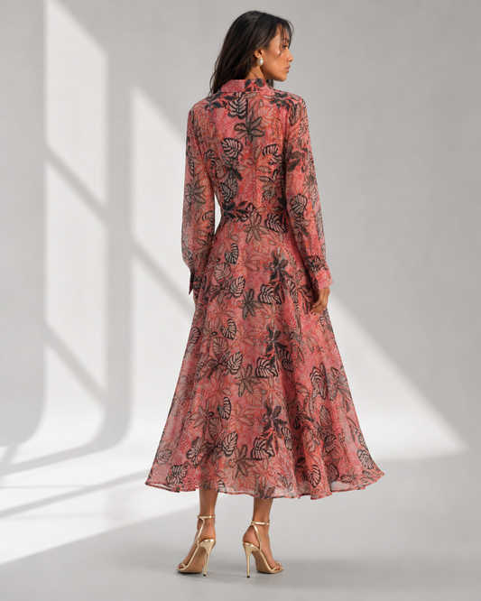 CORALIA coral leaf print maxi dress with fitted waist and flared skirt by Neha Sharma Label