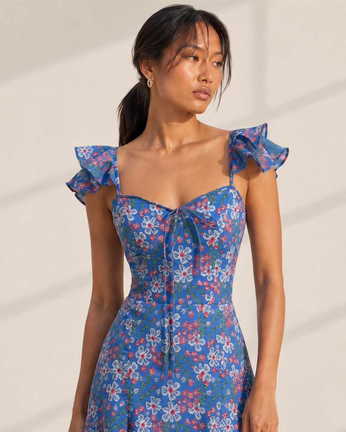 ROMY cornflower blue midi dress with white daisy floral print and sweetheart neckline.