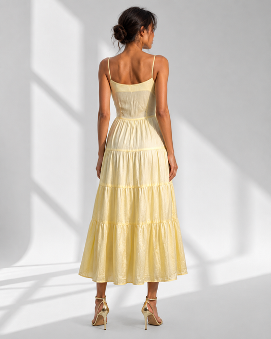 Back view of the SUNNIVA yellow tiered sundress showing the scooped back and piped tiers.