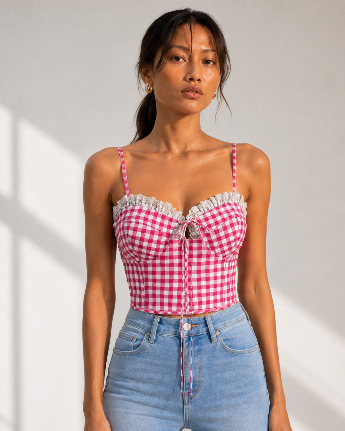 Model wearing EDIE rose-pink gingham bustier crop top by Neha Sharma Label.
