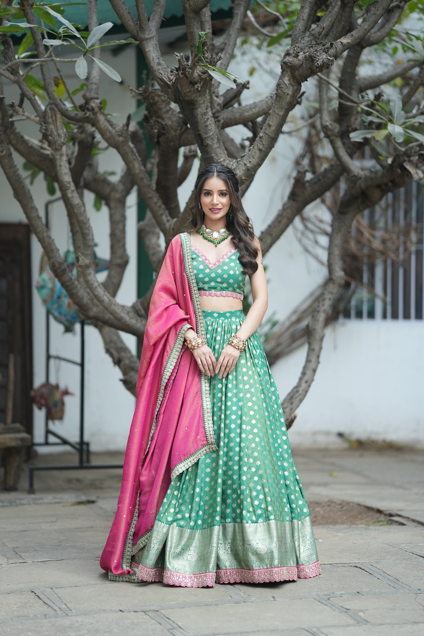 golden zari buti work on the Emerald Opulence Green Banarasi Lehenga