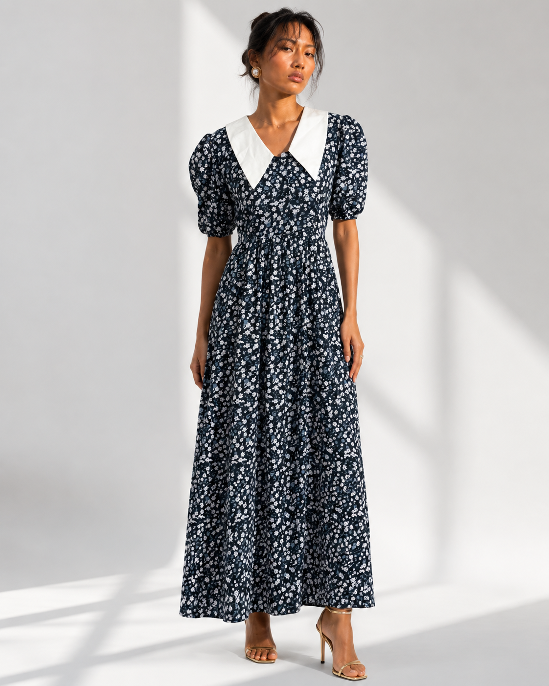 Neha Sharma Label EULALIE navy floral maxi dress with an oversized white collar, front view on model.