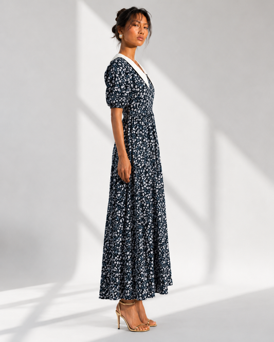 EULALIE navy floral contrast collar maxi dress in profile with short puff sleeves.
