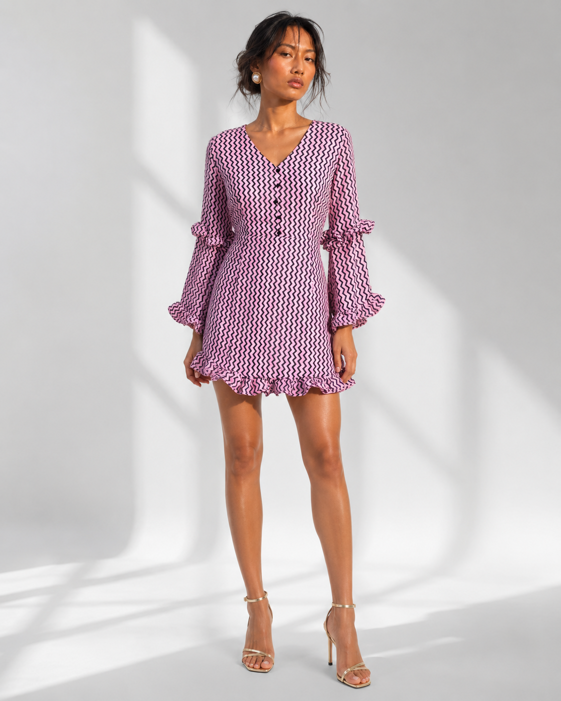 Neha Sharma Label SUZON lilac pink zigzag print mini dress with ruffle sleeves, front view on model.