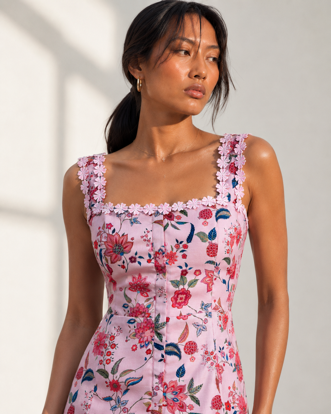 Detail of the rose and berry floral print and daisy guipure trim on CAMILLE.