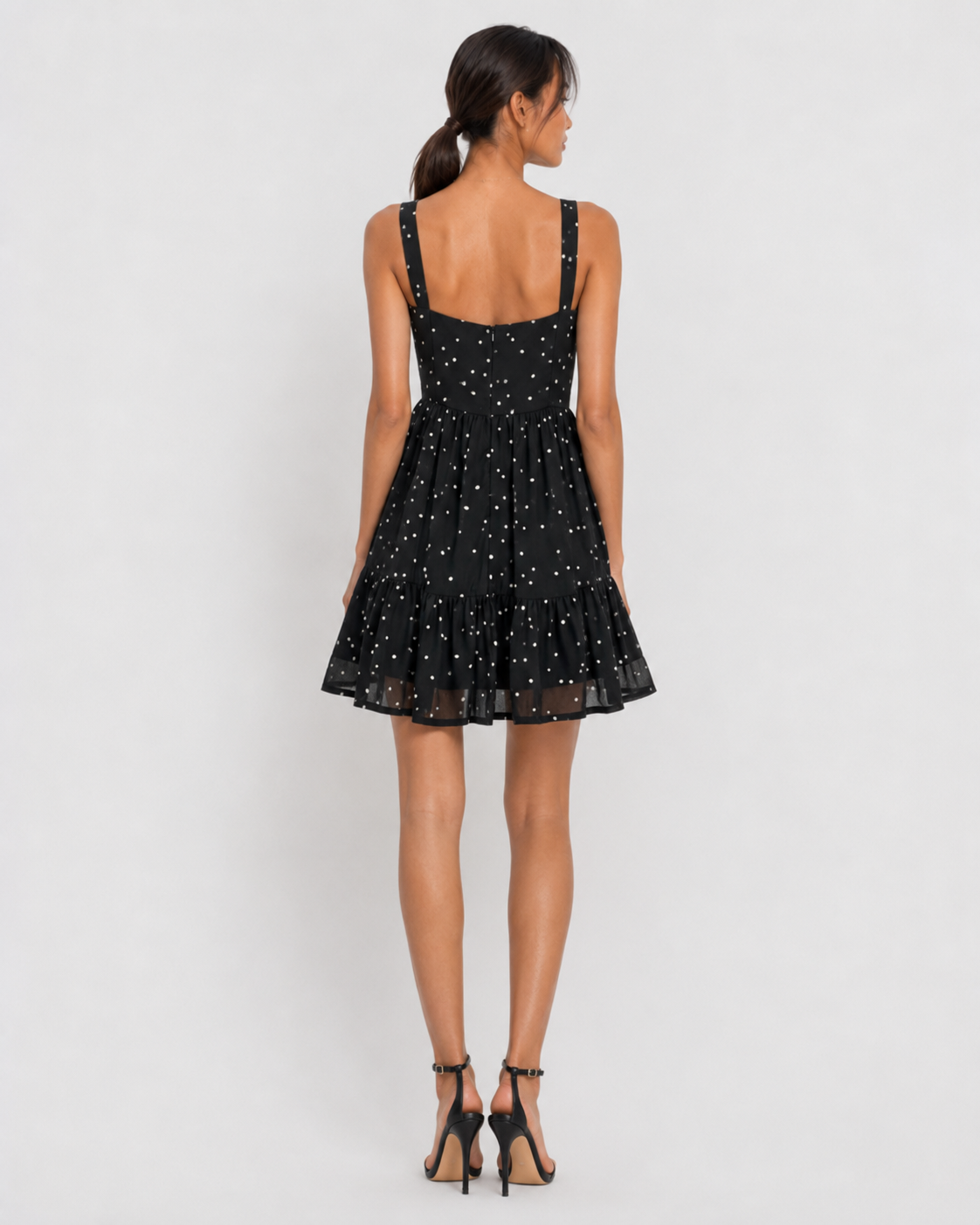 Detail of the scattered dots and ruffle hem tier with sheer band on VERA.