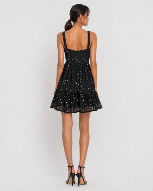 Detail of the scattered dots and ruffle hem tier with sheer band on VERA.