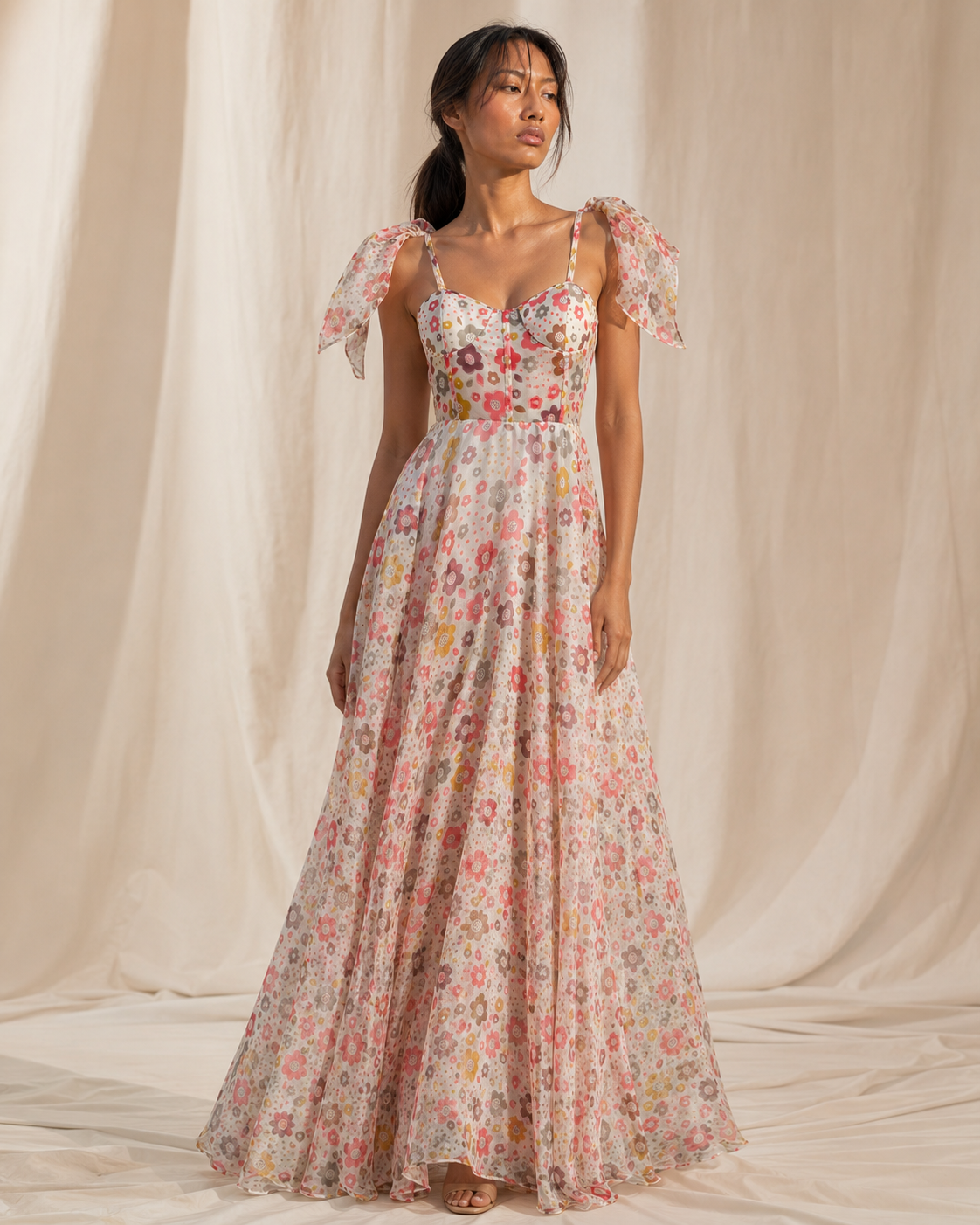 Model wearing PALOMA ivory retro floral print maxi dress by Neha Sharma Label.