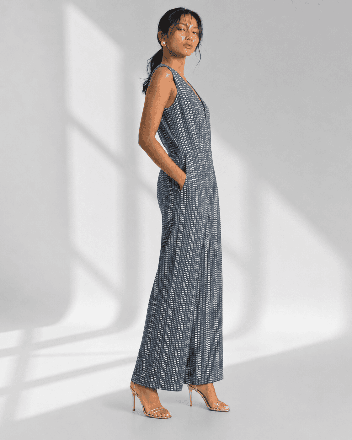 AVENZA grey cotton jumpsuit with V neck and concealed front opening by Neha Sharma Label