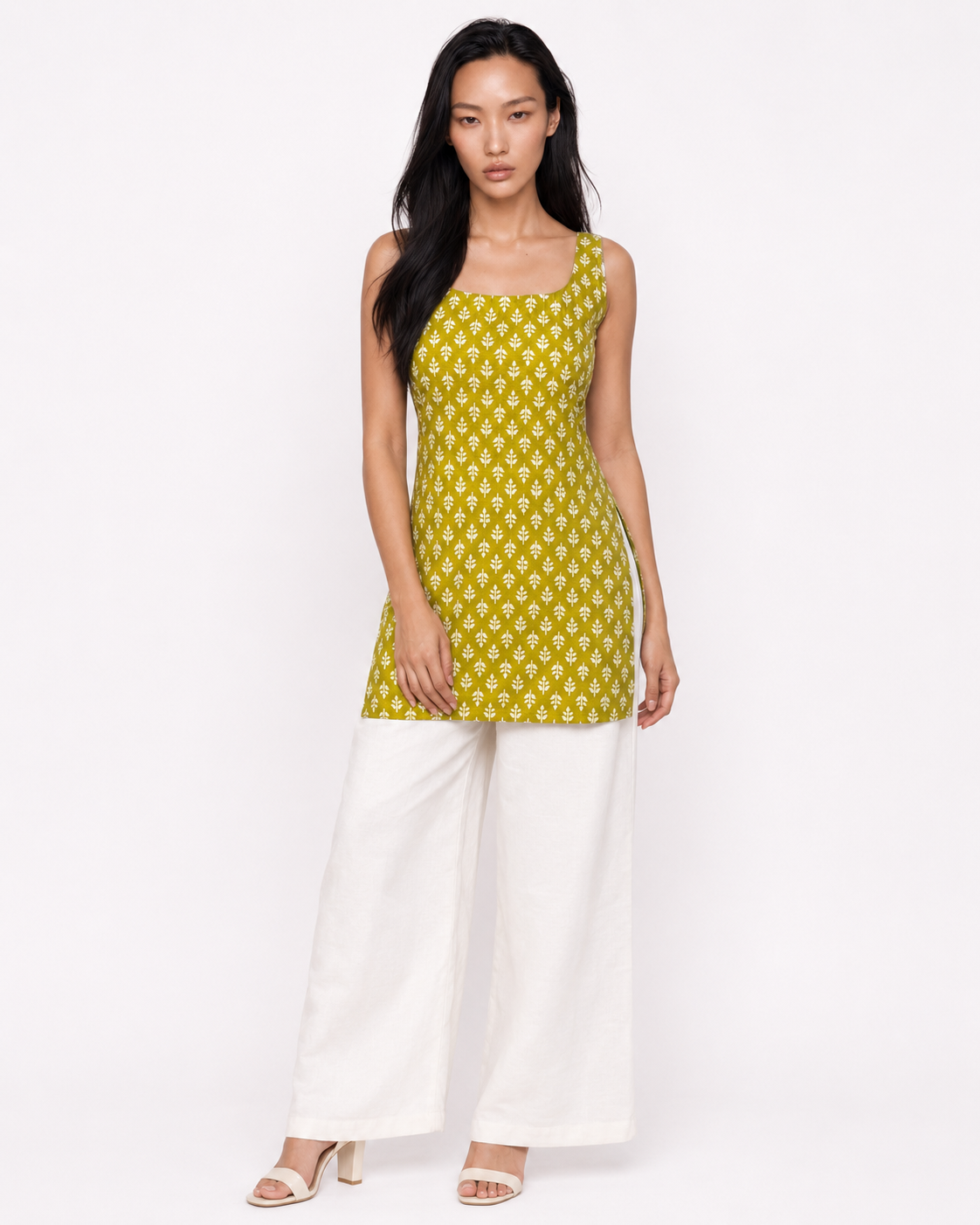 Model wearing MAHRU olive sprig print sleeveless kurti with square neckline by Neha Sharma Label - front view