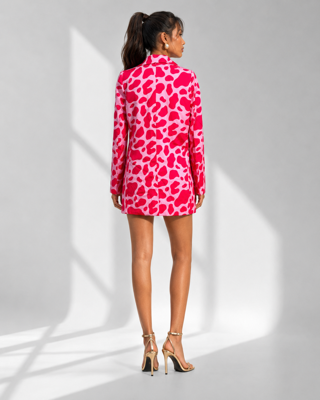 Back view of the FRANCA pink animal print blazer dress showing the tailored fit.