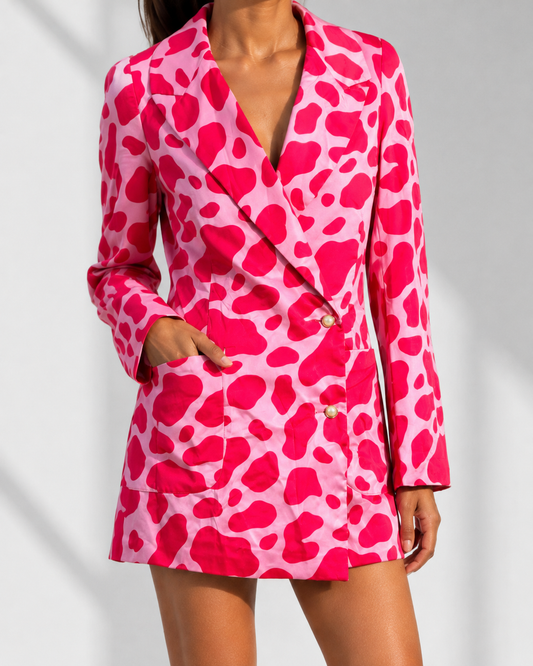 Close view of the pearl-effect buttons, lapels and patch pockets on the FRANCA blazer dress.