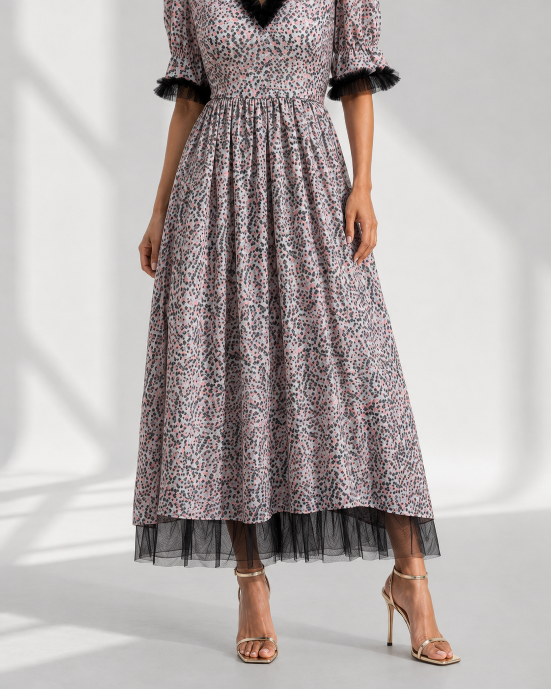 Close view of the tulle ruffle neckline and puff sleeve on the MELUSINE speckle maxi dress.