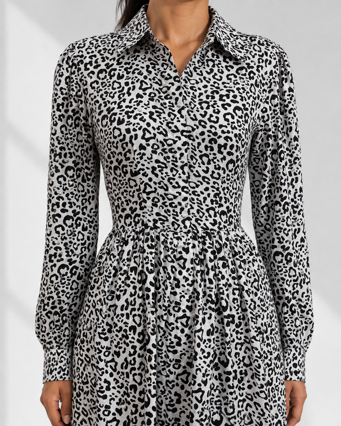 Close view of the oversized collar and concealed placket on the LEONTINE leopard shirt dress.