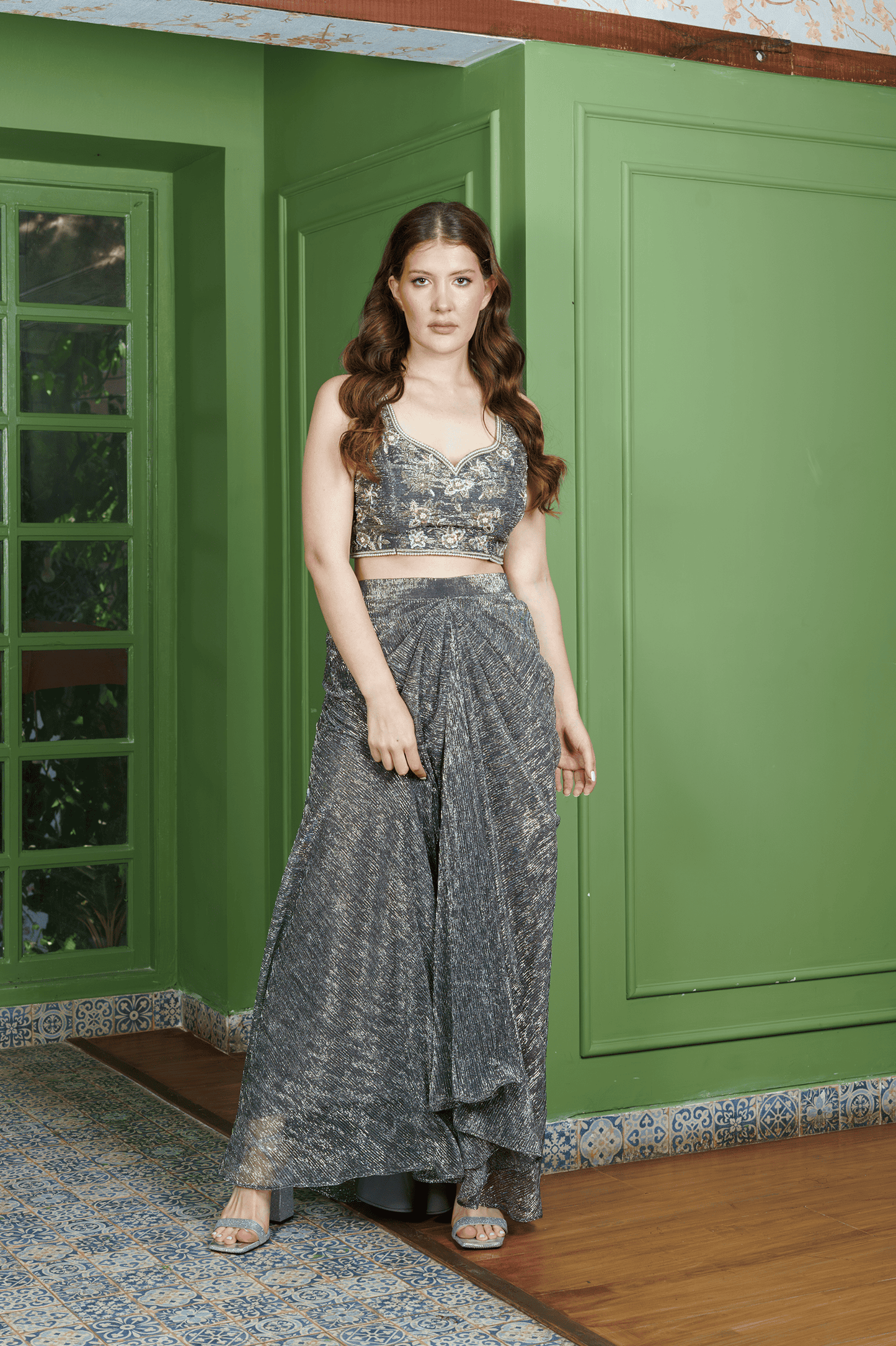Front view of gray dhoti set for women featuring shimmer dhoti skirt and floral embroidered crop top ?festive Indo-Western outfit by Neha Sharma Label.