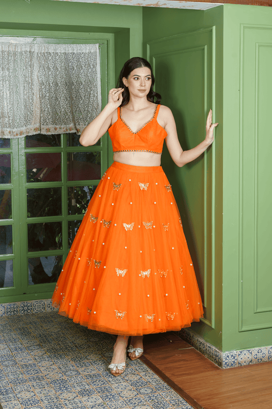 orange lehenga choli with pearl accents for party wear