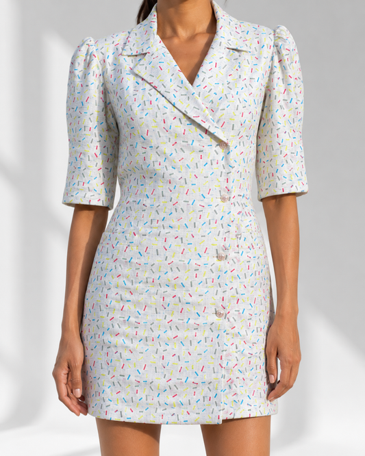 Close view of the offset buttons, lapels and confetti print on the LUDOVICA blazer dress.